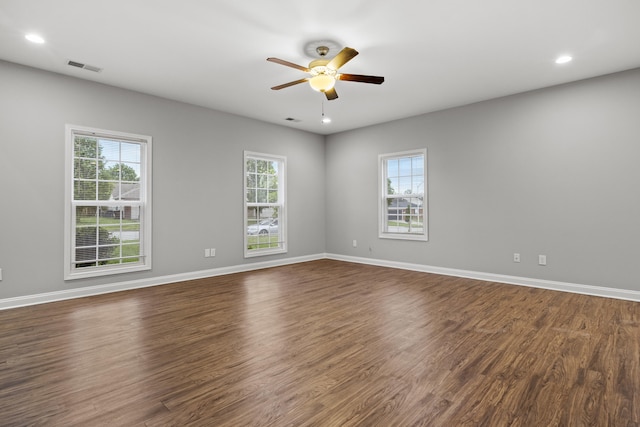 spare room featuring ceiling fan, dark wood finished floors, baseboards, and recessed lighting