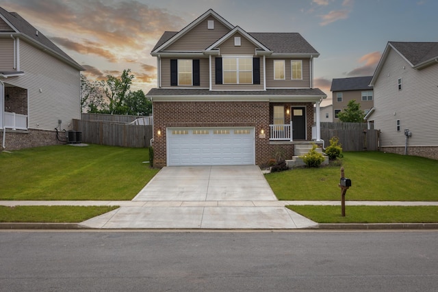 140 Peaceful Lndg, Georgetown, KY 40324 - view of front facade featuring concrete driveway, an attached garage, brick siding, central AC, and a porch