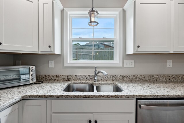 140 Peaceful Lndg, Georgetown, KY 40324 - kitchen featuring dishwasher, a sink, white cabinets, and decorative light fixtures