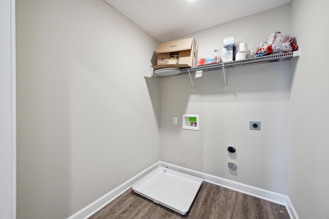 140 Peaceful Lndg, Georgetown, KY 40324 - washroom featuring washer hookup, hookup for a gas dryer, electric dryer hookup, wood finished floors, and baseboards