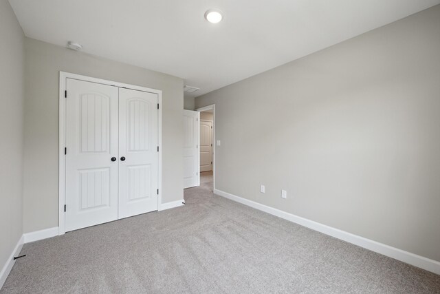 140 Peaceful Lndg, Georgetown, KY 40324 - unfurnished bedroom featuring carpet, a closet, and baseboards
