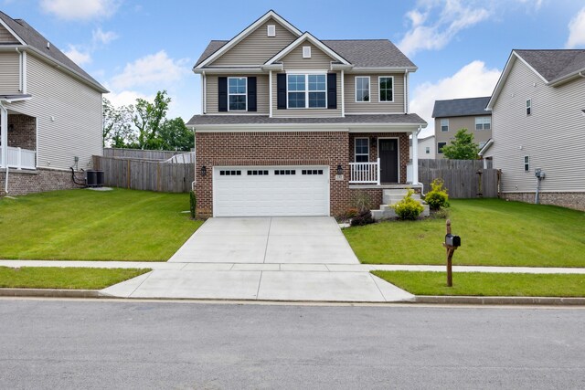 140 Peaceful Lndg, Georgetown, KY 40324 - view of front of property featuring brick siding, an attached garage, concrete driveway, covered porch, and cooling unit