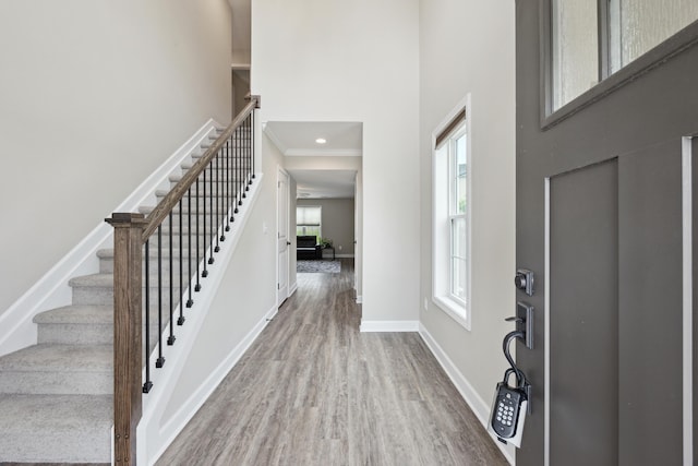 140 Peaceful Lndg, Georgetown, KY 40324 - entryway with wood finished floors, a high ceiling, baseboards, stairway, and ornamental molding