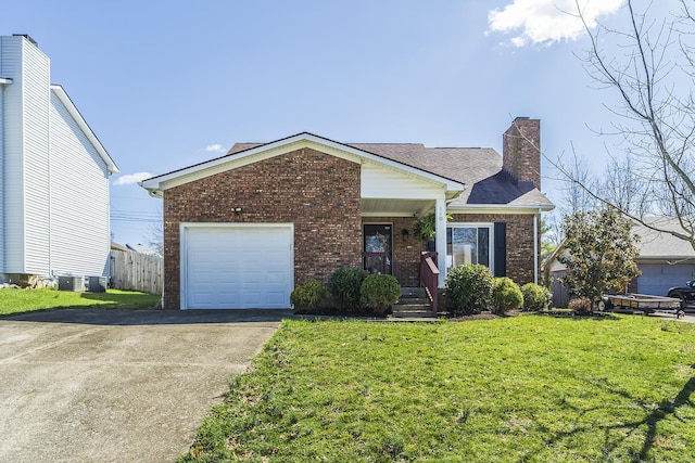 view of front of house with brick siding, a chimney, concrete driveway, a garage, and central AC