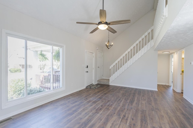 entrance foyer with dark wood-type flooring, baseboards, and stairway