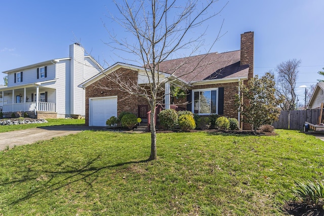 view of front of property featuring driveway, brick siding, an attached garage, and a chimney