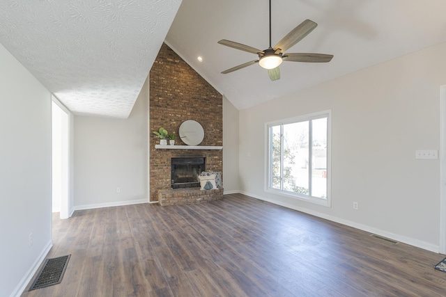 unfurnished living room featuring a ceiling fan, dark wood-style floors, a brick fireplace, baseboards, and high vaulted ceiling