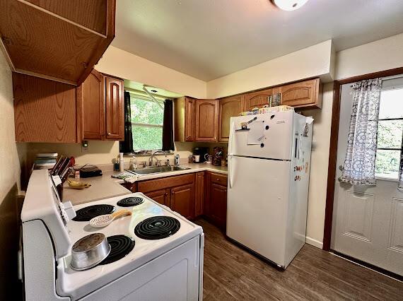 4216 N Ky 11, Cannon, KY 40923 - kitchen featuring white appliances, a sink, brown cabinetry, light countertops, and dark wood-style flooring
