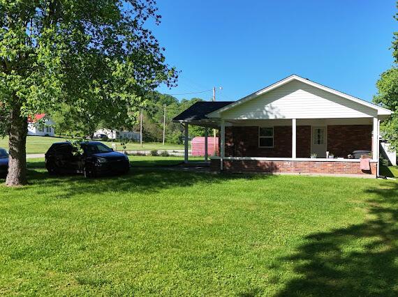 4216 N Ky 11, Cannon, KY 40923 - rear view of house featuring a yard and brick siding