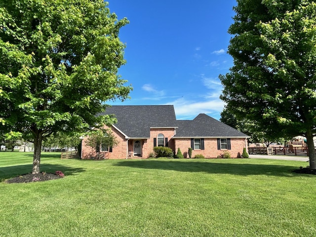 296 Ferry Rd, Somerset, KY 42503 - view of front of home featuring a front lawn, roof with shingles, and brick siding