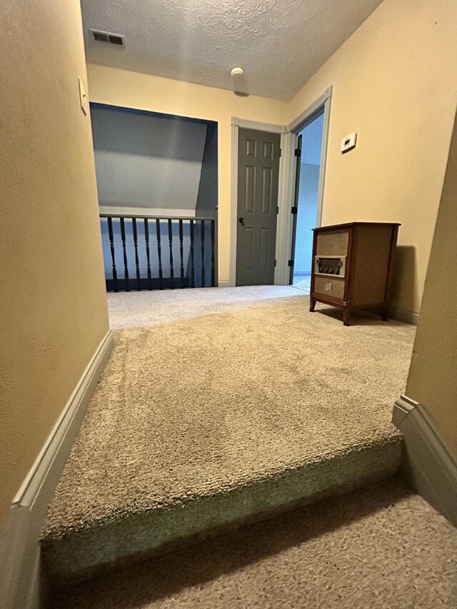 296 Ferry Rd, Somerset, KY 42503 - unfurnished bedroom with carpet flooring, a textured ceiling, and baseboards