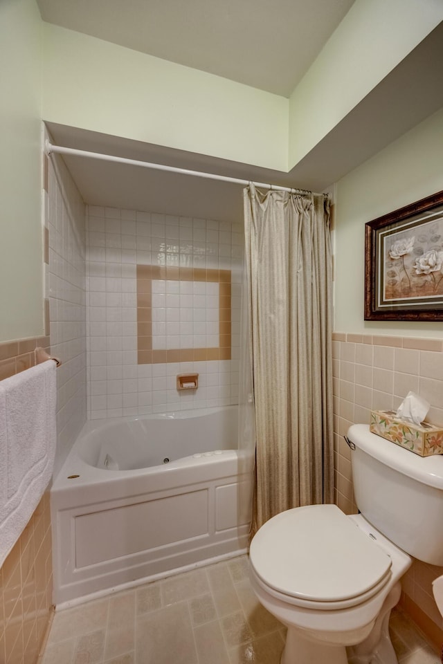 445 Cecilian Ter, Danville, KY 40422 - full bathroom featuring tile walls, toilet, shower / tub combo with curtain, and wainscoting