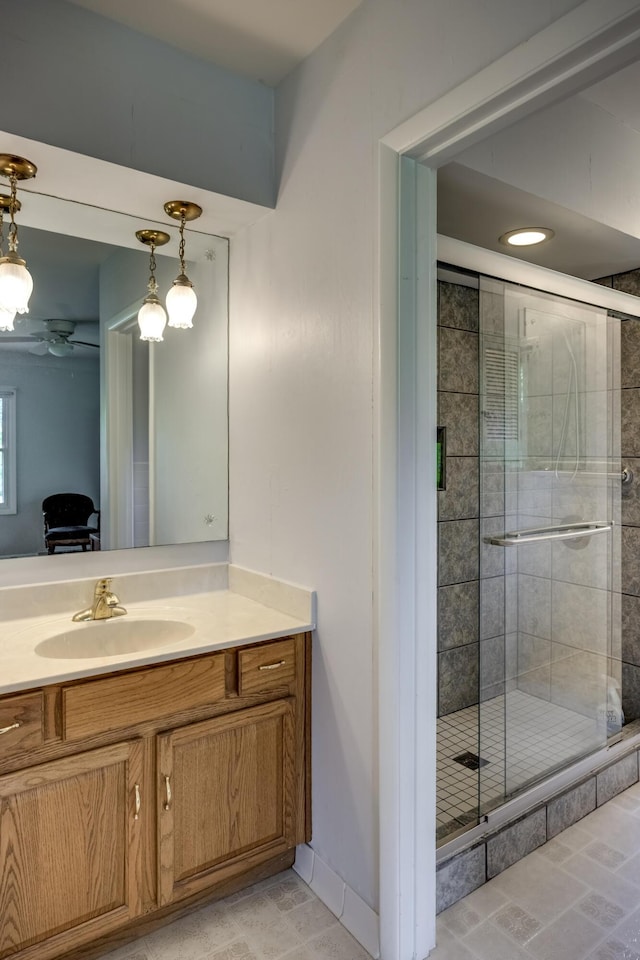 445 Cecilian Ter, Danville, KY 40422 - bathroom featuring vanity, a stall shower, a ceiling fan, and baseboards