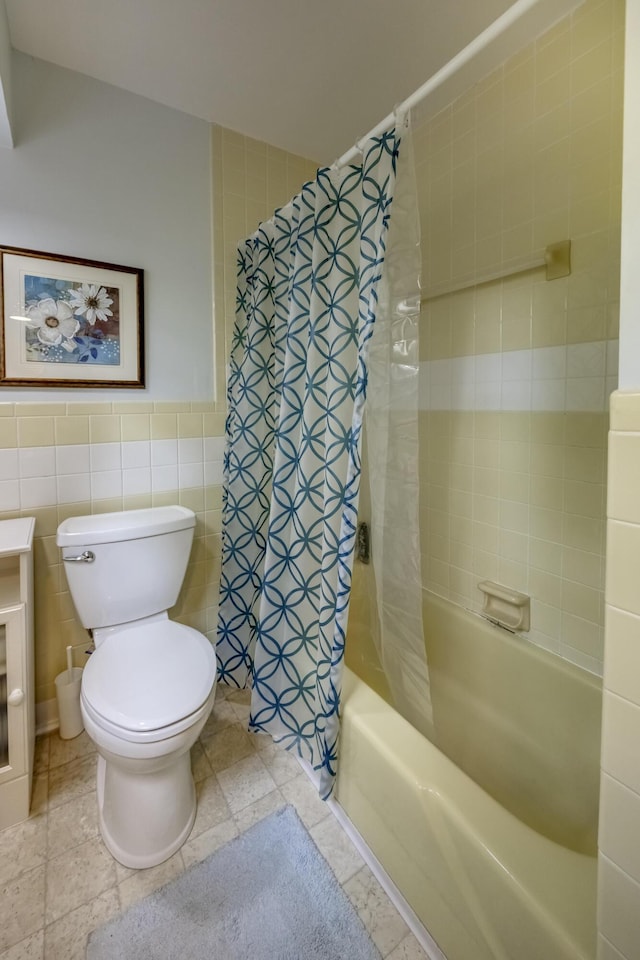 445 Cecilian Ter, Danville, KY 40422 - bathroom featuring toilet, shower / bath combo with shower curtain, and tile walls