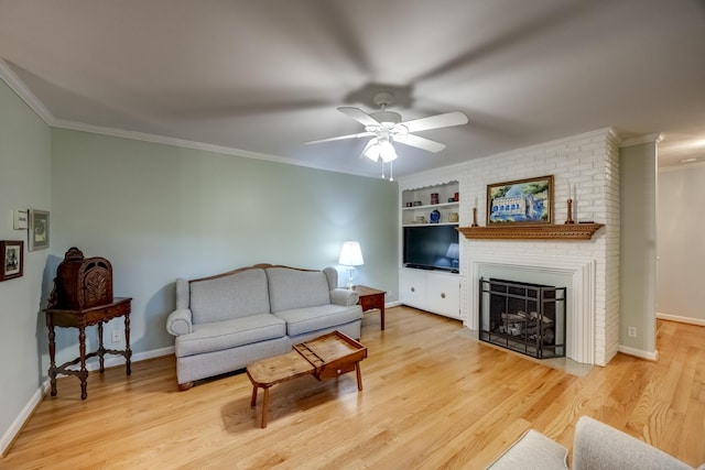 445 Cecilian Ter, Danville, KY 40422 - living area featuring crown molding, light wood-style floors, ceiling fan, built in features, and baseboards