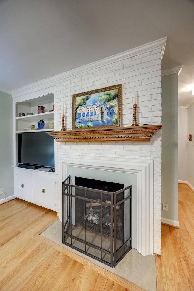 445 Cecilian Ter, Danville, KY 40422 - detailed view of crown molding, a brick fireplace, wood finished floors, and baseboards