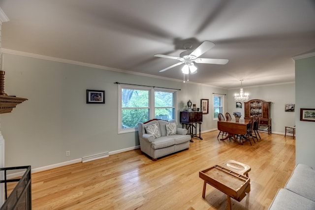 445 Cecilian Ter, Danville, KY 40422 - living room with a chandelier, ceiling fan, light wood-style floors, ornamental molding, and baseboards