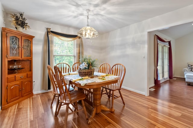 240 Percheron Dr, Richmond, KY 40475 - dining room with light wood-type flooring, a chandelier, and baseboards