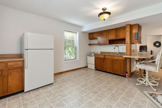 240 Percheron Dr, Richmond, KY 40475 - kitchen with white appliances, a sink, open shelves, and brown cabinets