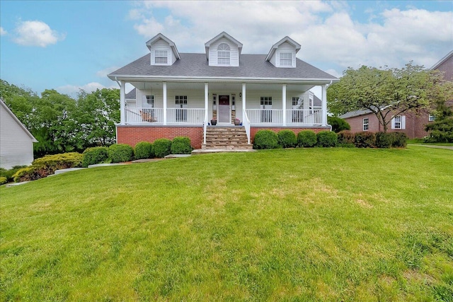 835 Isaac Shelby Cir, Frankfort, KY 40601 - cape cod-style house featuring a front yard, covered porch, and a shingled roof