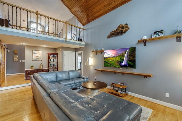 835 Isaac Shelby Cir, Frankfort, KY 40601 - living area featuring wood ceiling, baseboards, wood finished floors, and high vaulted ceiling