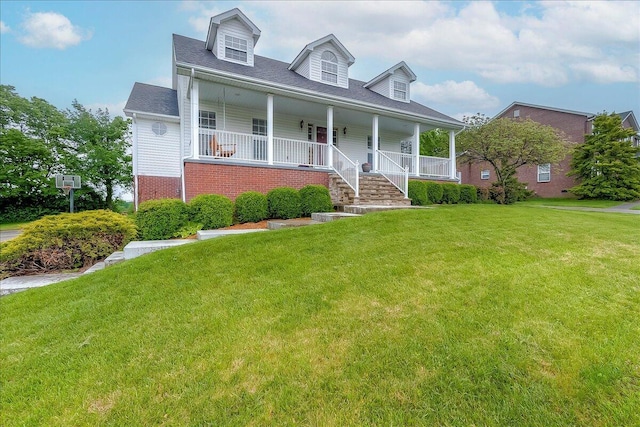 835 Isaac Shelby Cir, Frankfort, KY 40601 - cape cod home featuring a front yard, a porch, and brick siding