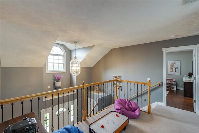 835 Isaac Shelby Cir, Frankfort, KY 40601 - additional living space with carpet floors, lofted ceiling, baseboards, and a chandelier