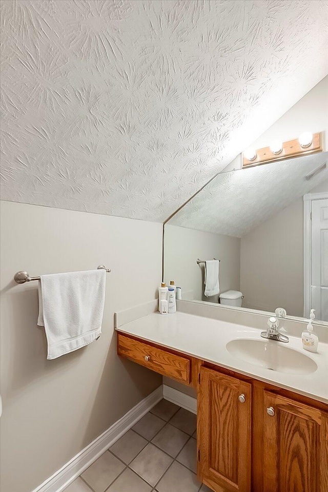 835 Isaac Shelby Cir, Frankfort, KY 40601 - half bathroom with a textured ceiling, tile patterned flooring, vanity, toilet, and vaulted ceiling