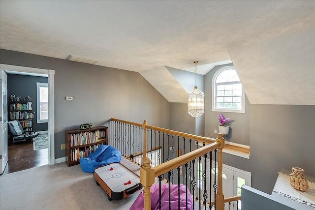 835 Isaac Shelby Cir, Frankfort, KY 40601 - hallway featuring an upstairs landing, healthy amount of natural light, baseboards, vaulted ceiling, and carpet floors
