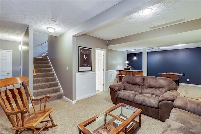 835 Isaac Shelby Cir, Frankfort, KY 40601 - carpeted living area with a textured ceiling, stairs, and baseboards