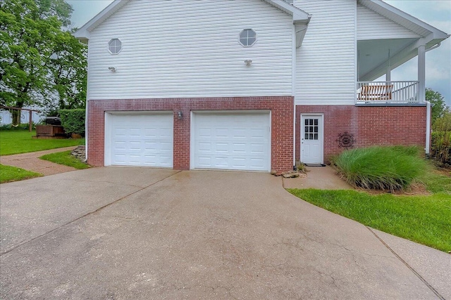 835 Isaac Shelby Cir, Frankfort, KY 40601 - view of side of home featuring brick siding, an attached garage, and driveway