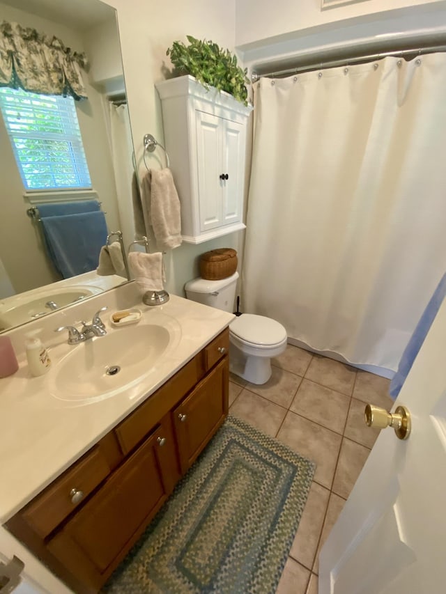 45 Rons Pond Rd, Corbin, KY 40701 - bathroom with toilet, vanity, and tile patterned floors