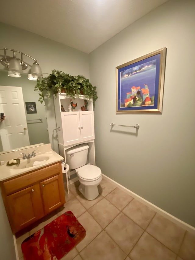 45 Rons Pond Rd, Corbin, KY 40701 - bathroom with toilet, vanity, tile patterned floors, and baseboards