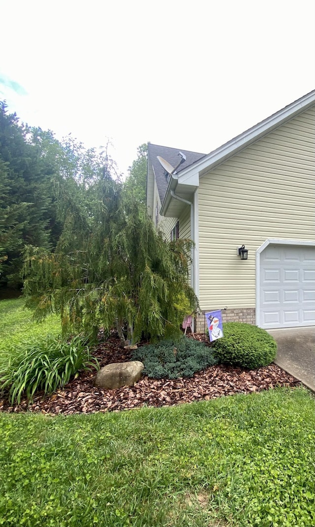 45 Rons Pond Rd, Corbin, KY 40701 - view of side of home with a garage and concrete driveway