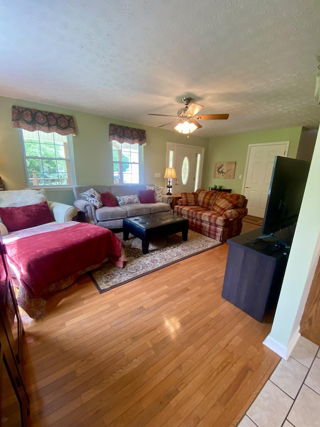 45 Rons Pond Rd, Corbin, KY 40701 - living area with a textured ceiling, ceiling fan, and light wood-type flooring