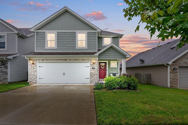 view of front of home with a front yard, stone siding, concrete driveway, and a garage