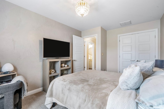 bedroom featuring carpet flooring, baseboards, a closet, and a chandelier