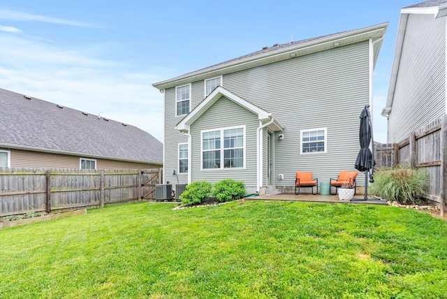 rear view of house featuring a patio area and central air condition unit