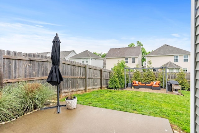 view of yard with a patio, an outdoor hangout area, and a residential view
