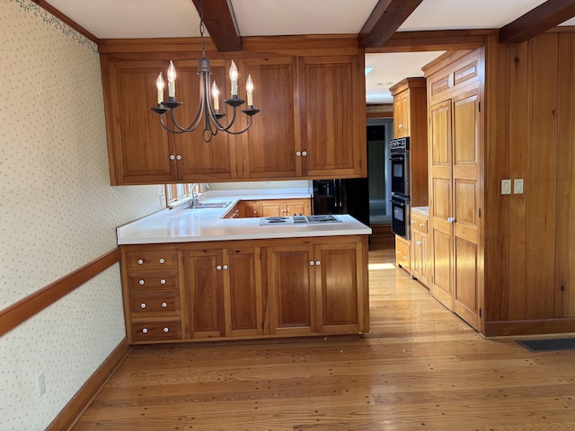 1439 Stanford St, Lancaster, KY 40444 - kitchen with wallpapered walls, brown cabinets, a sink, stovetop with downdraft, and a peninsula