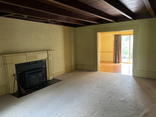 1439 Stanford St, Lancaster, KY 40444 - unfurnished living room featuring light colored carpet, beamed ceiling, and a wood stove