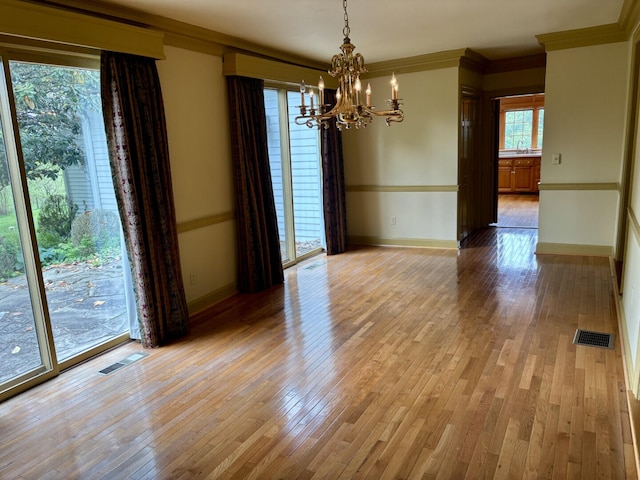 1439 Stanford St, Lancaster, KY 40444 - empty room featuring a chandelier, crown molding, baseboards, light wood-style floors, and a sink