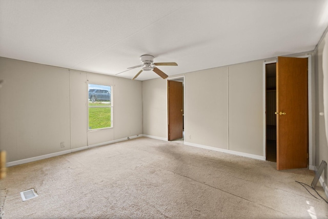3145 Lily Rd, London, KY 40744 - unfurnished bedroom with light carpet, a ceiling fan, and baseboards