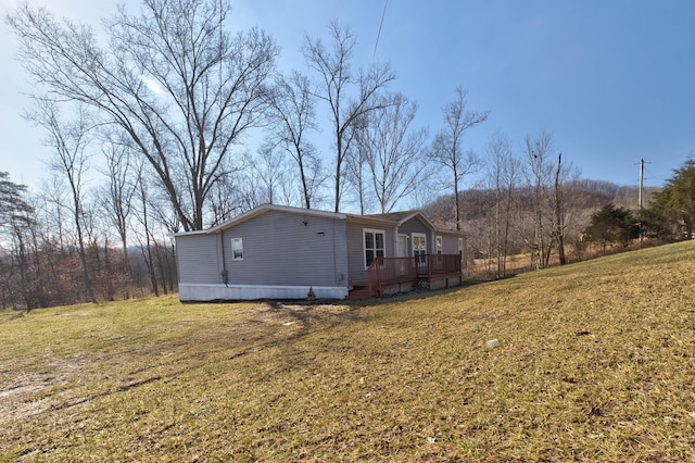 619 Routt Rd, Wallingford, KY 41093 - rear view of house with a deck and a yard