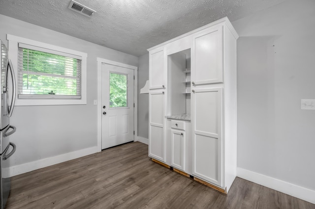 524 Joel St, Lexington, KY 40508 - doorway to outside featuring dark wood-type flooring and a textured ceiling