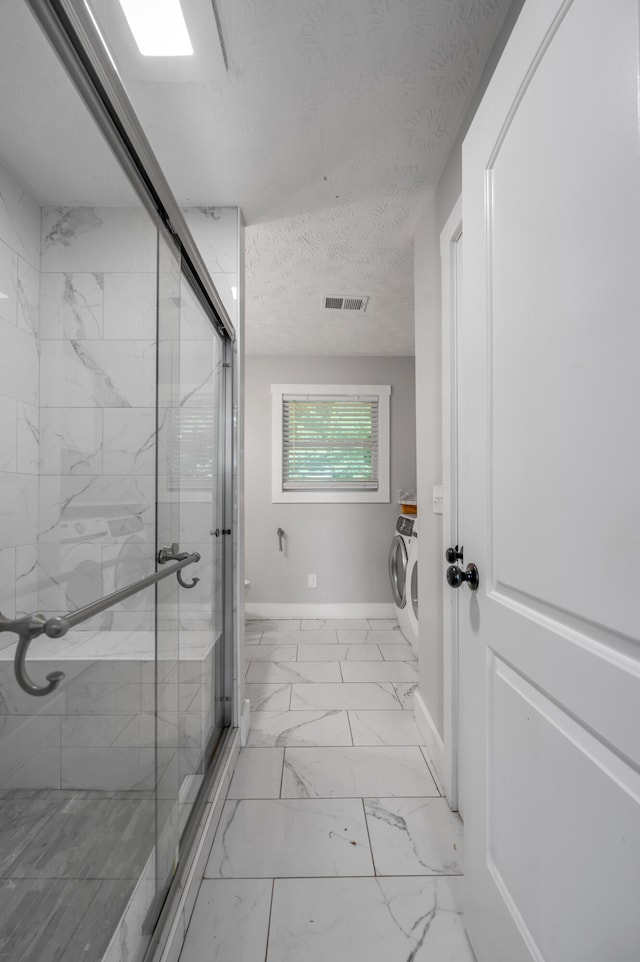 524 Joel St, Lexington, KY 40508 - full bath featuring marble finish flooring, a shower stall, washer and clothes dryer, and a textured ceiling