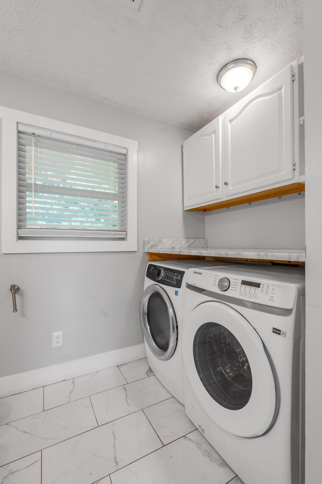 524 Joel St, Lexington, KY 40508 - laundry room with washer and dryer, cabinet space, light marble finish flooring, and a textured ceiling