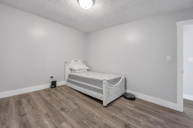 524 Joel St, Lexington, KY 40508 - bedroom with wood finished floors and a textured ceiling