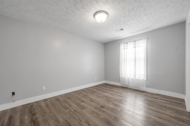 524 Joel St, Lexington, KY 40508 - spare room featuring a textured ceiling and wood finished floors