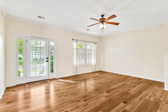 doorway to outside featuring light wood-style flooring, crown molding, a ceiling fan, and baseboards
